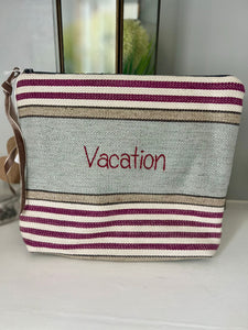 Handsewn zipped bag with phrase "Vacation"