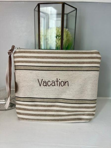 Handsewn zipped bag with phrase "Vacation"