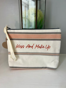 Handsewn fabric phrase zipped bag "Kiss & make up"