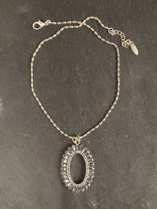 Crystal pendant on elipse beaded chain necklace